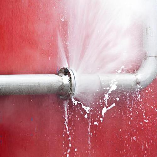 water coming from a burst pipe